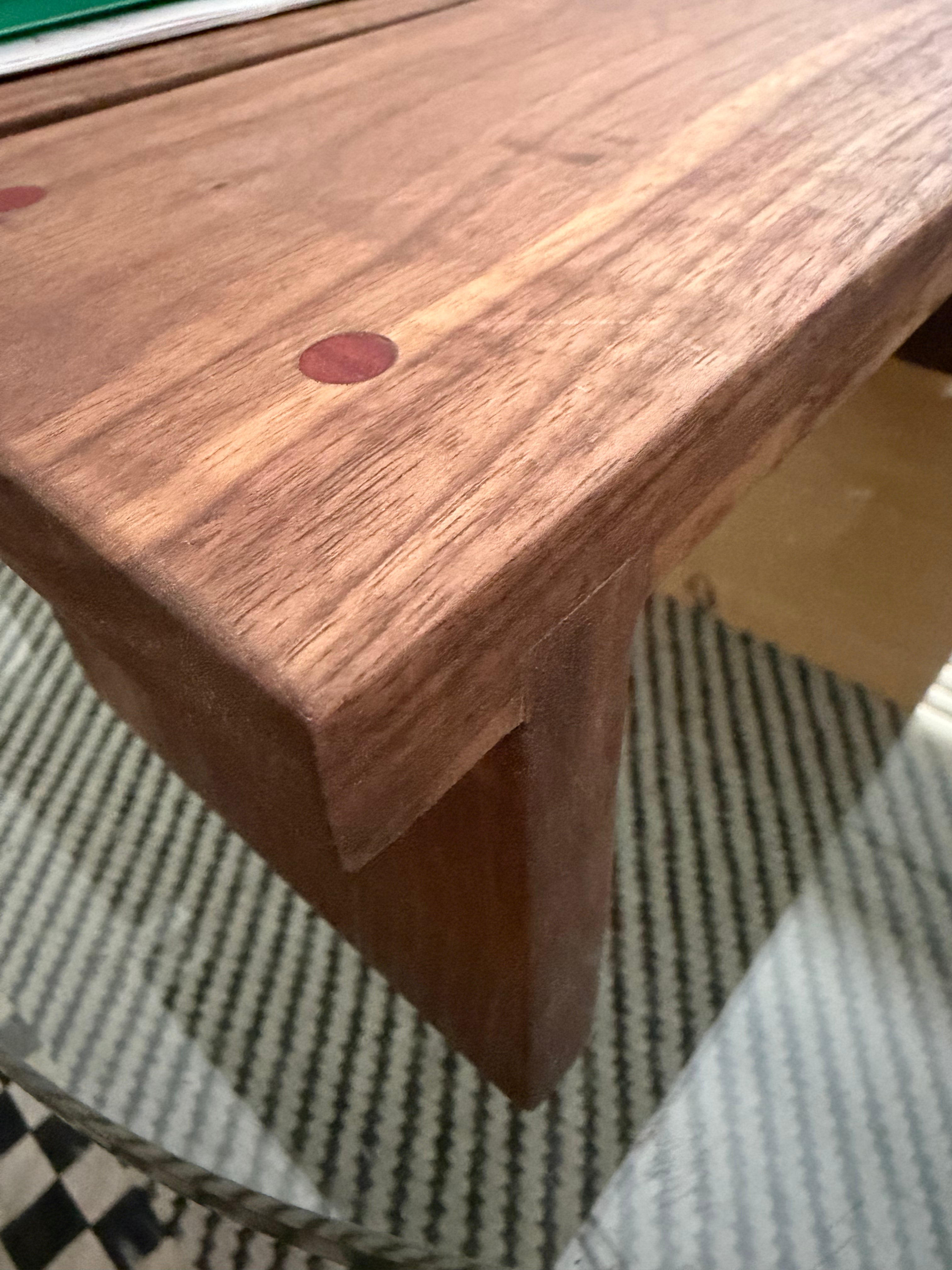 Hancrafted walnut charcuterie board with bloodwood accents.