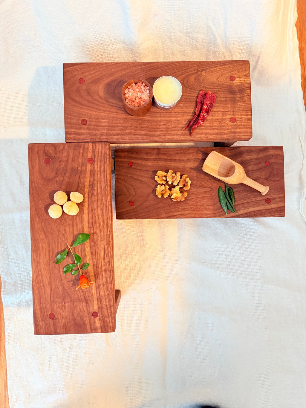Hancrafted walnut charcuterie board with bloodwood accents.