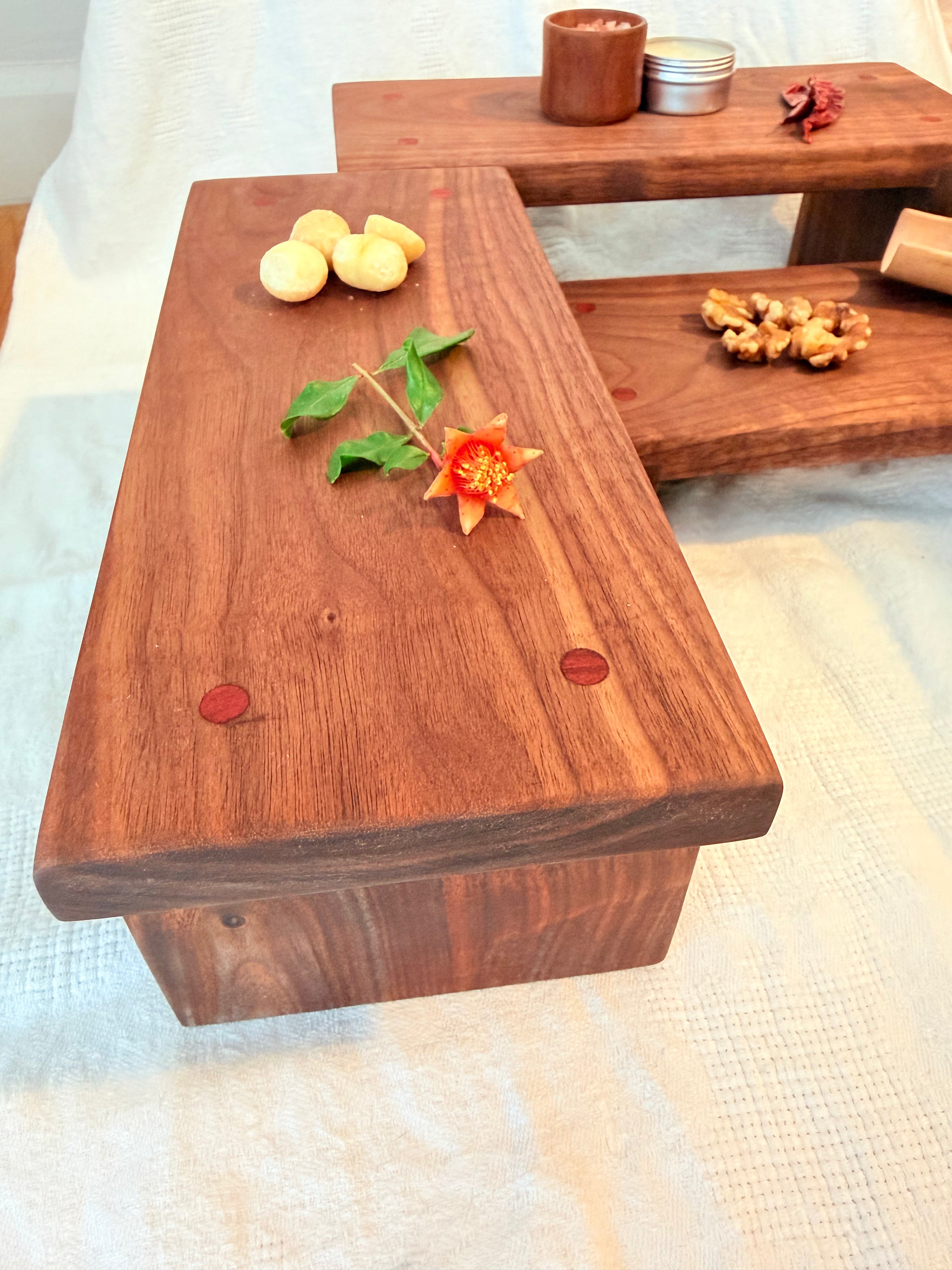Hancrafted walnut charcuterie board with bloodwood accents.