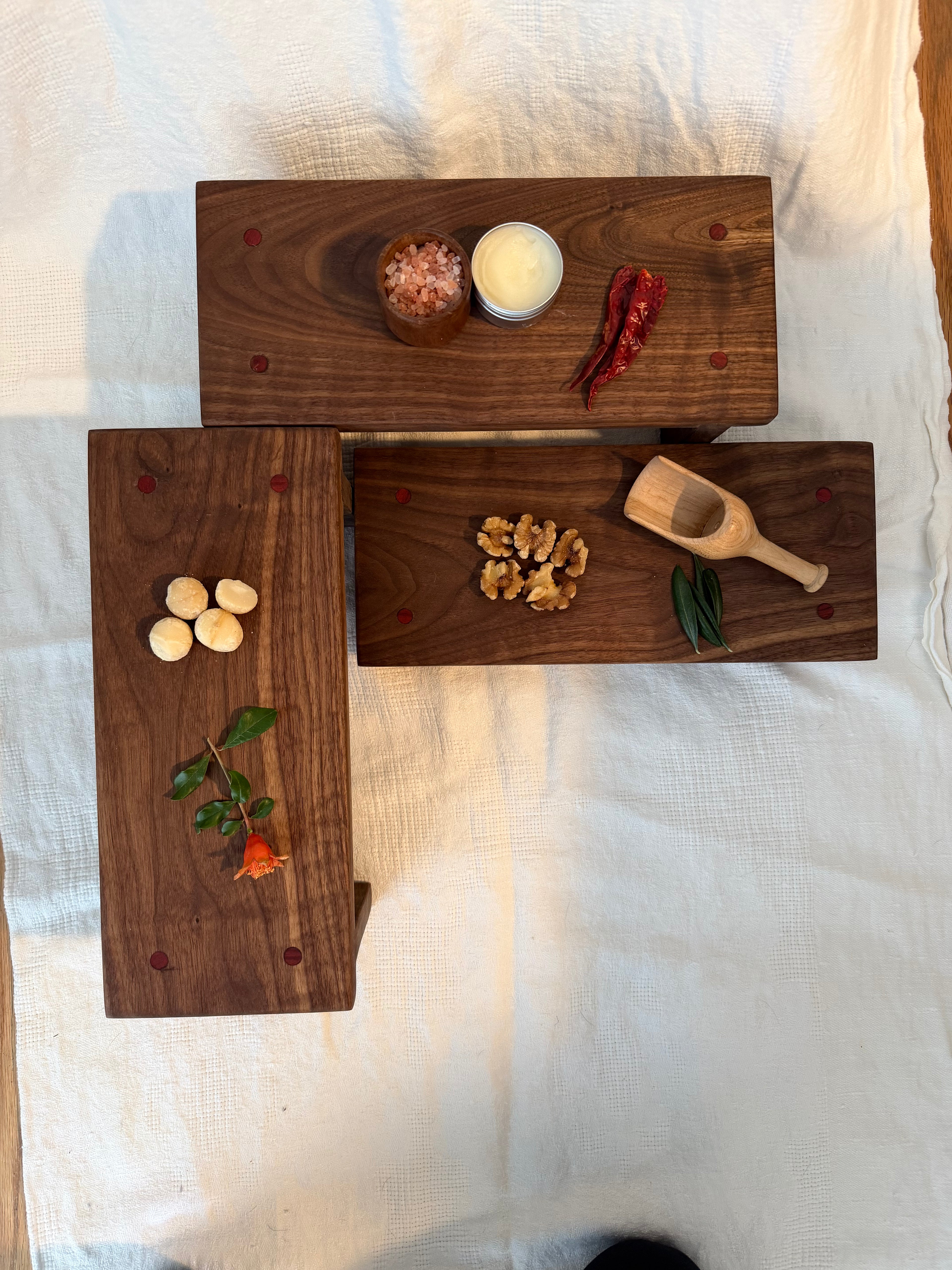 Hancrafted walnut charcuterie board with bloodwood accents.